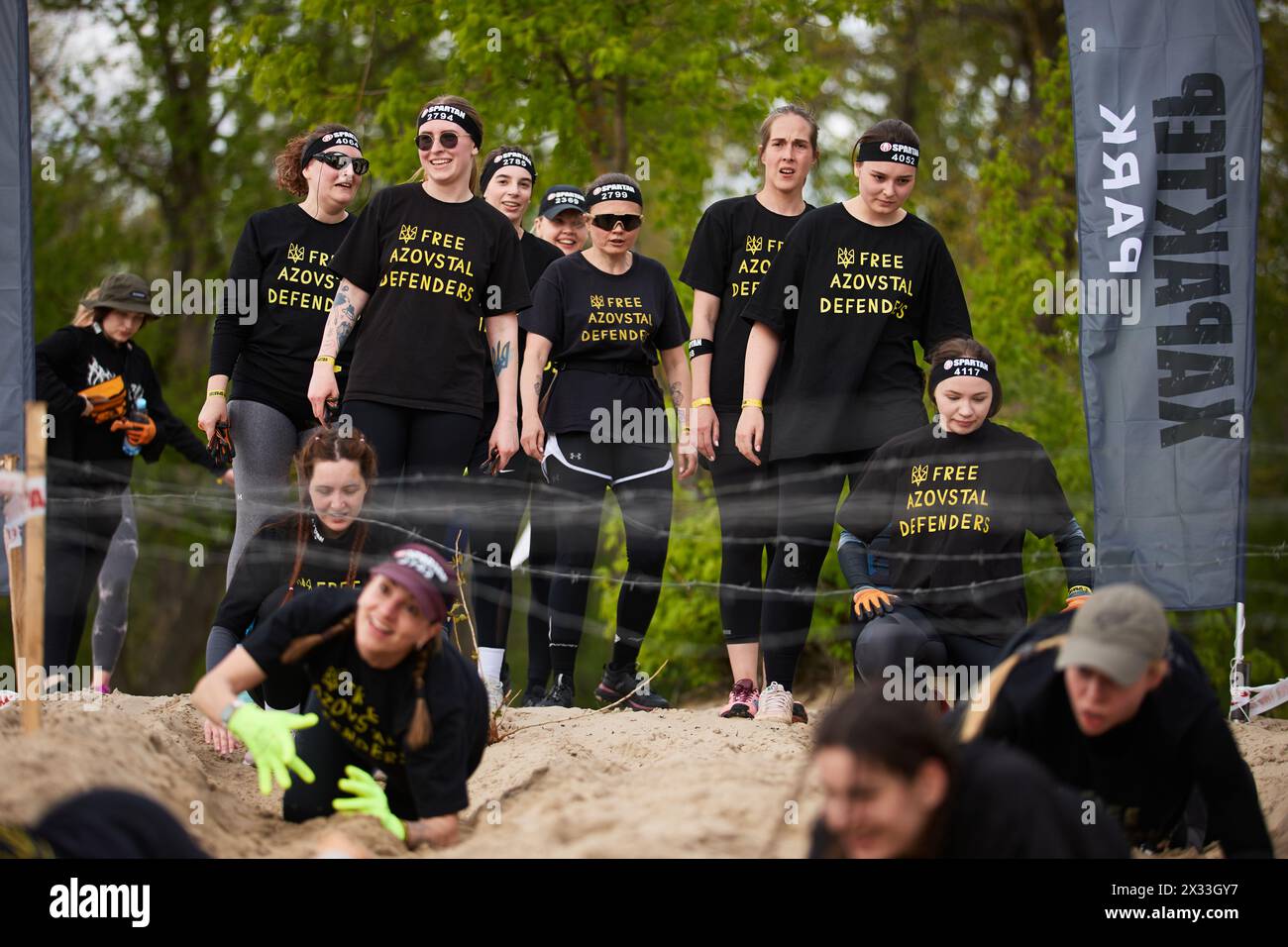 Group of Ukrainian women take part in the barbed wire crawl discipline ...