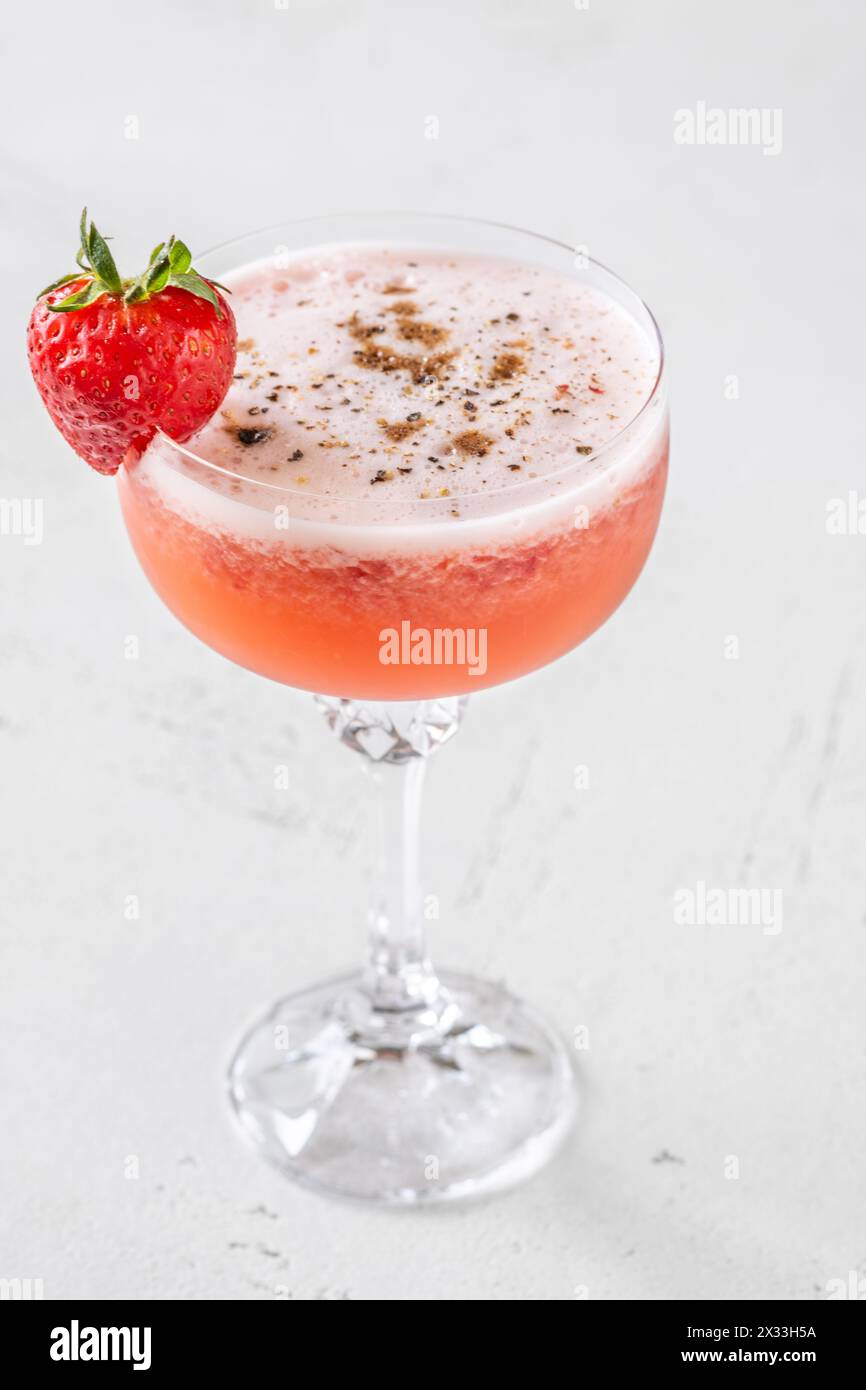 Strawberry fields cocktail garnished with balsamic vinegar drops Stock Photo