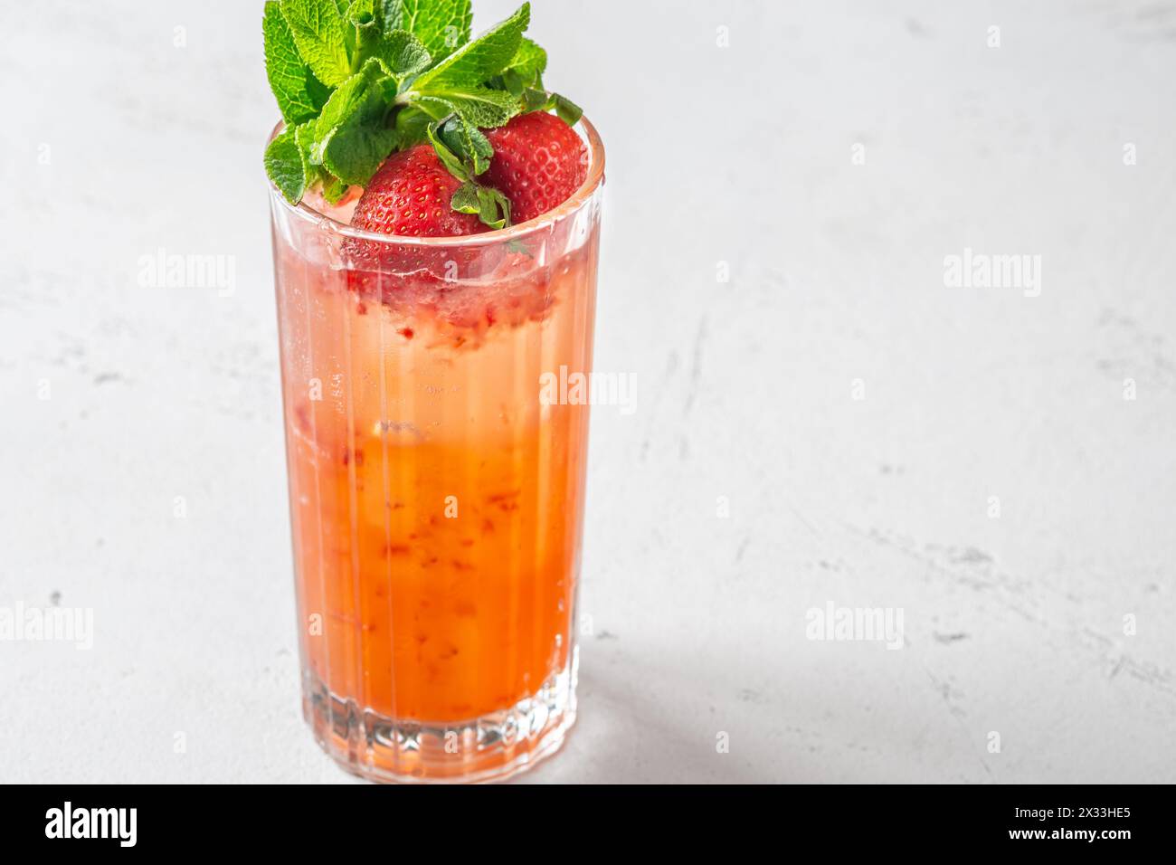 Glass of Courtside cocktail garnished with mint sprigs Stock Photo