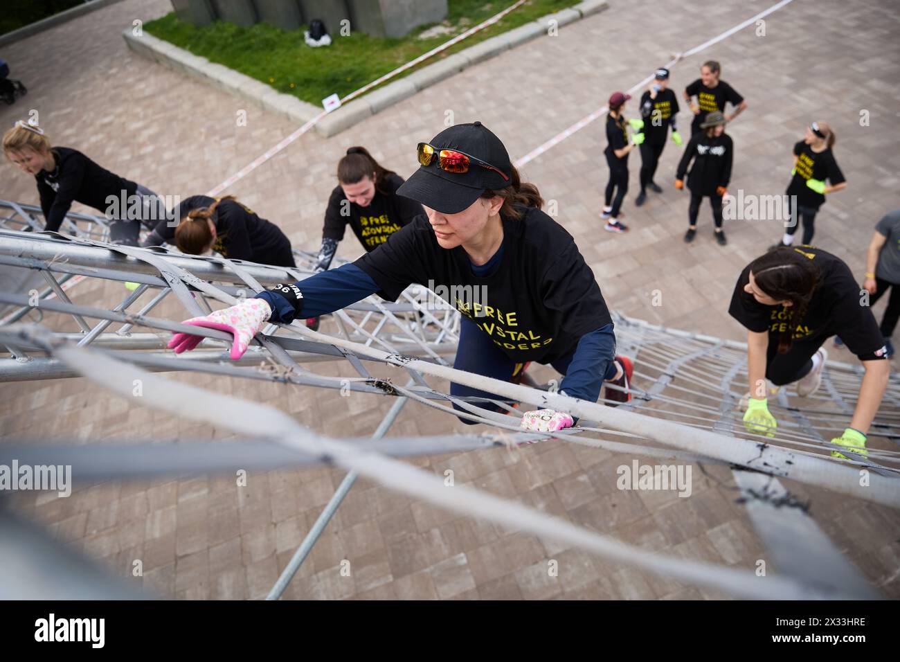 Ukrainian women climbing the "AFrame" obstacle at the Spartan Race