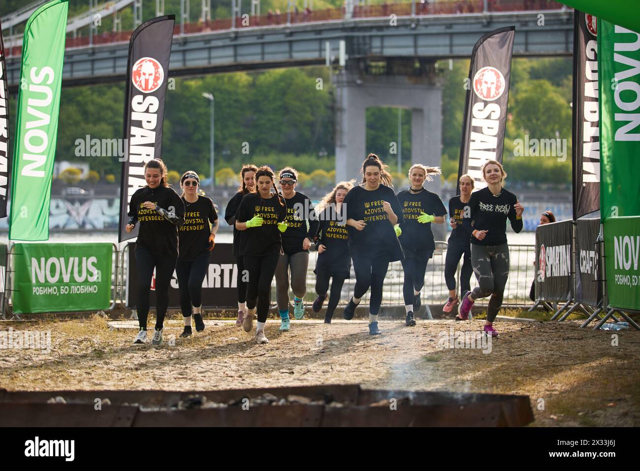 Group of Ukrainian women running towards the finish line at the Spartan