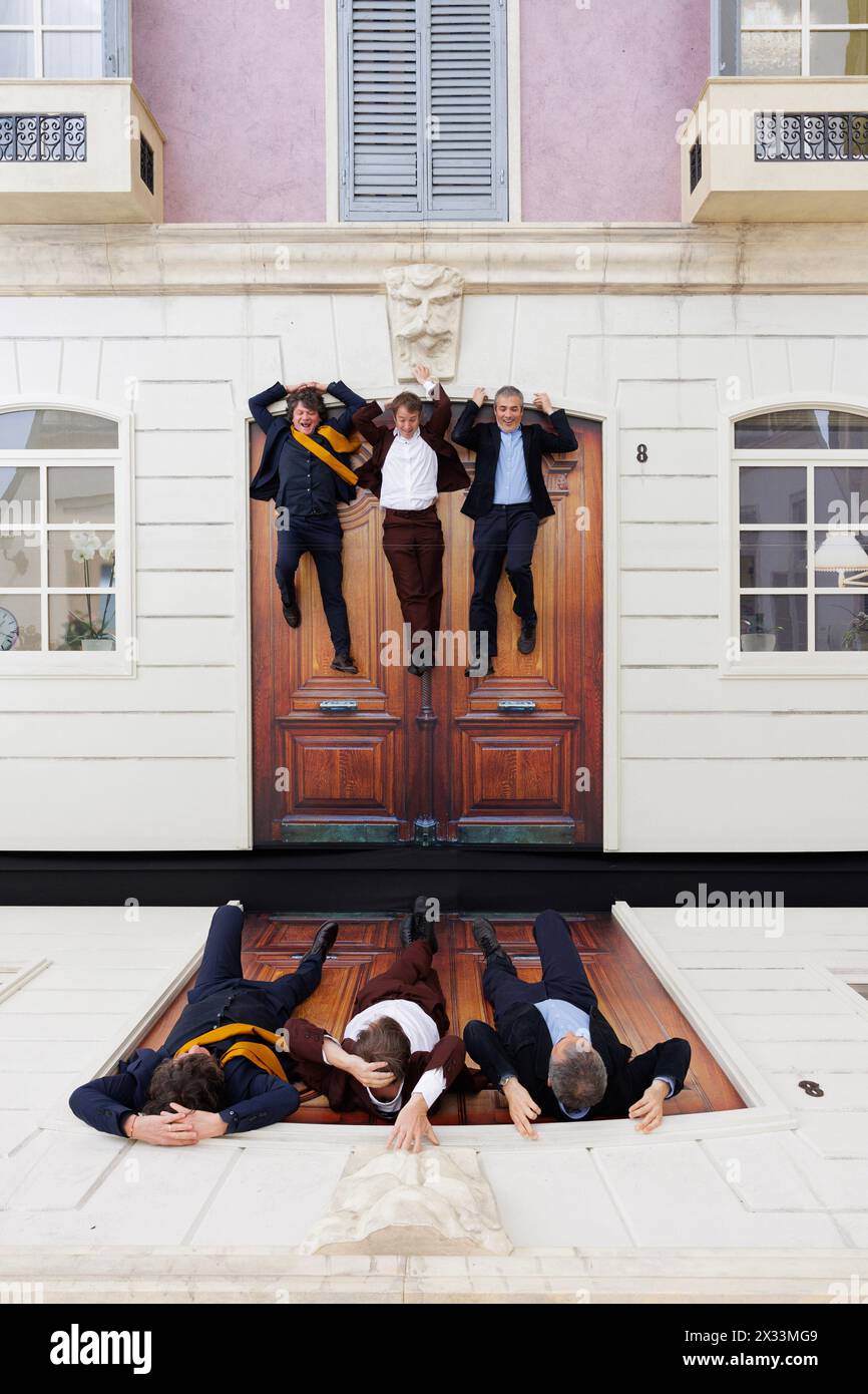 Portrait of Leandro Erlich (artist) (in the middle) in his artwork ...