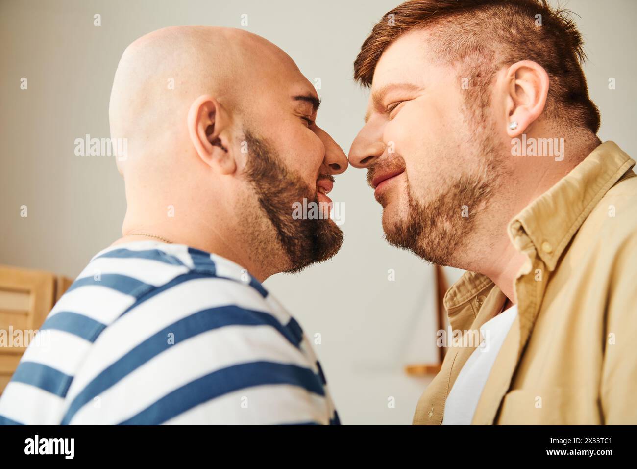 Two men stand tall beside each other. Stock Photo