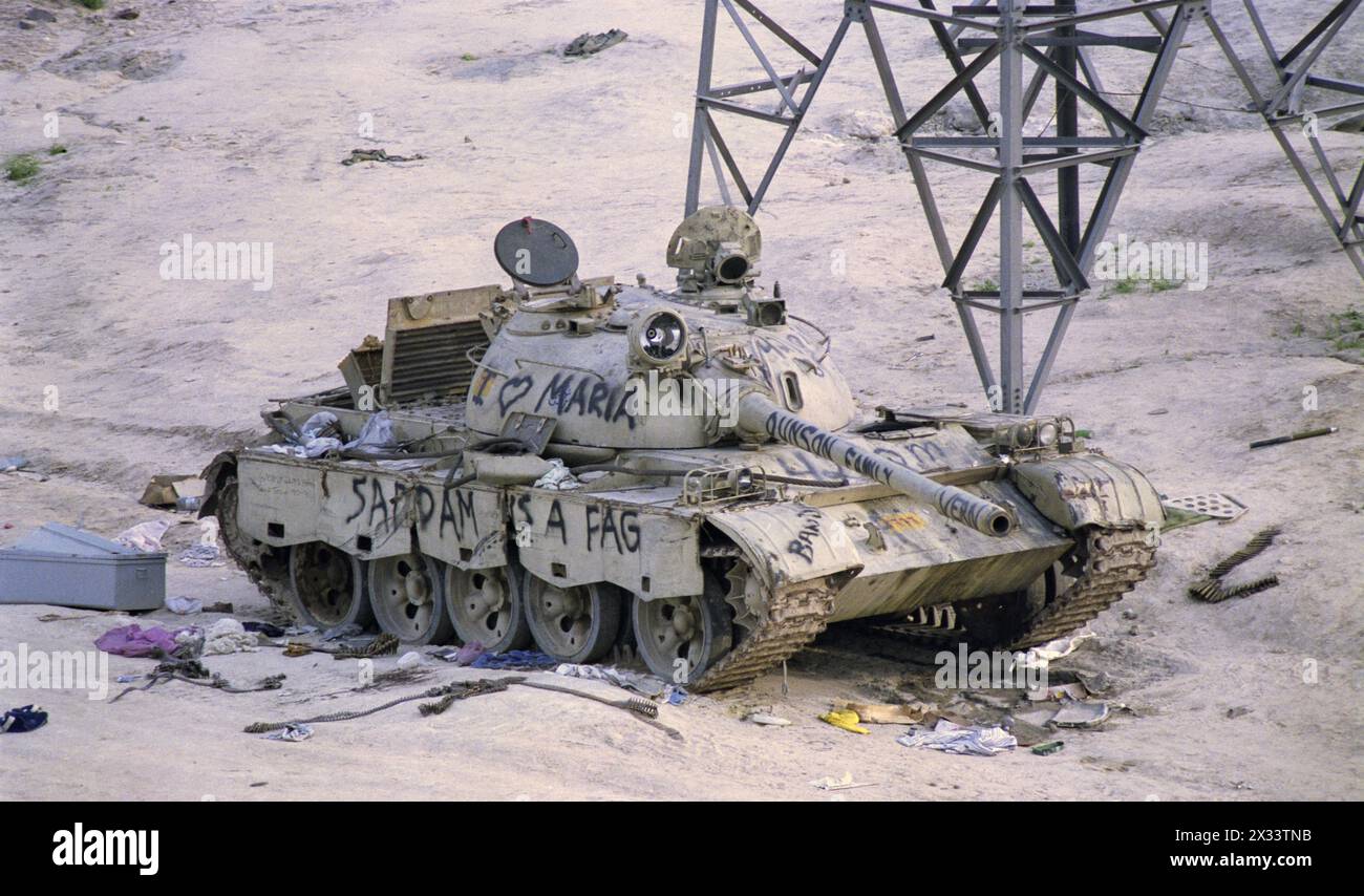 1st April 1991 U.S. Army graffiti on an Iraqi T55 tank on the “Highway of Death”, the main highway from Kuwait City to Basra. Stock Photo