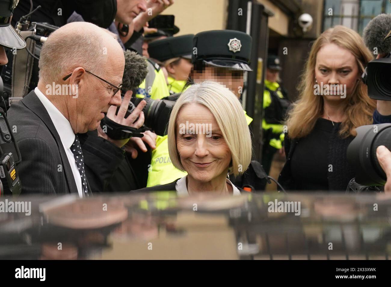 RETRANSMITTING AMENDING TOPIC EDITORS NOTE IMAGE PIXELLATED BY THE PA PICTURE DESK FOR THE PROTECTION OF OFFICERS OF THE PSNI Sir Jeffrey Donaldson's wife, Lady Eleanor Donaldson leaves Newry Magistrates' Court, after appearing to face charges in relation to the same police investigation as her husband, the former DUP leader, who appeared in court charged with rape and a number of other historical sex offences. Picture date: Wednesday April 24, 2024. Stock Photo