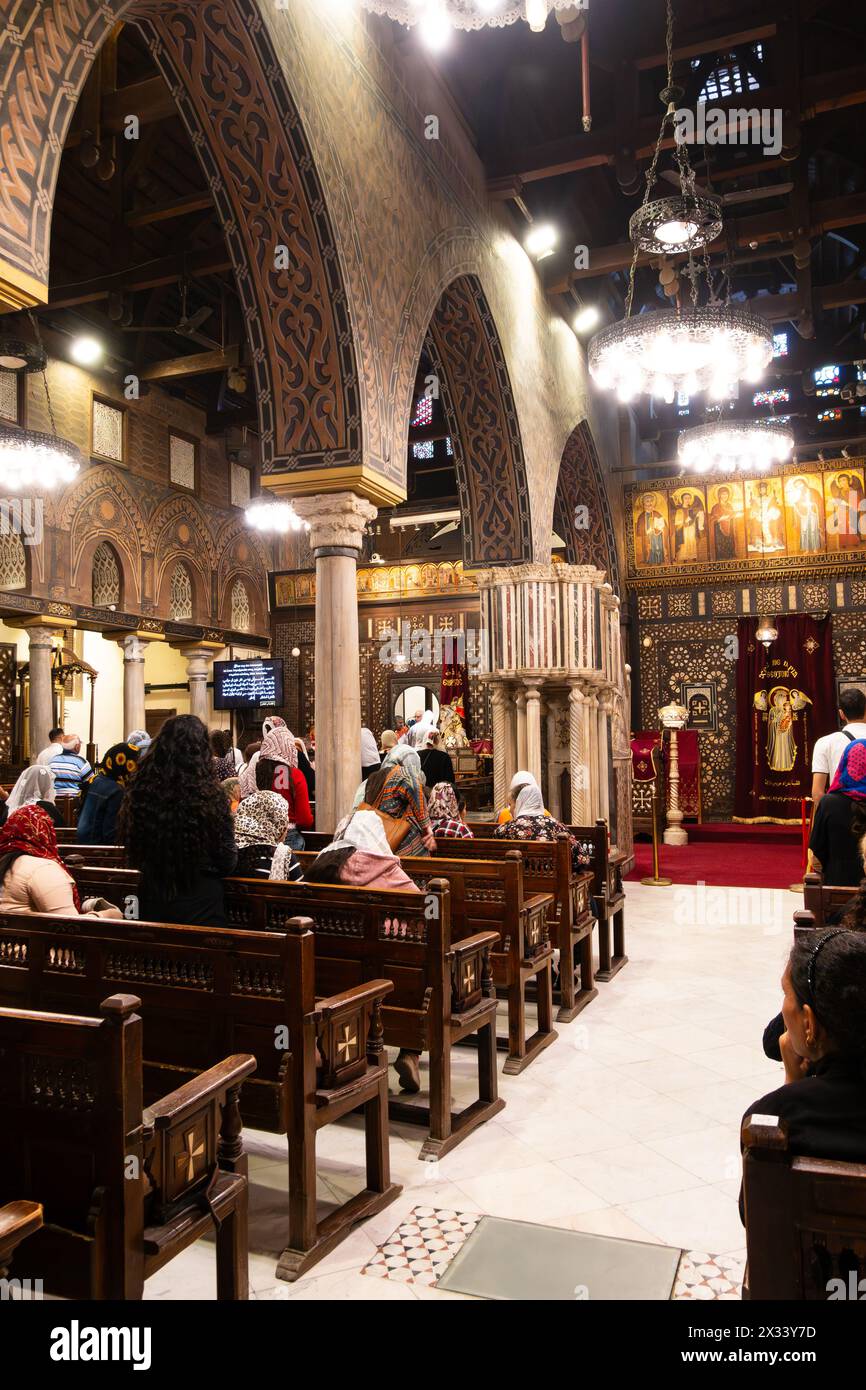 Worshipers in the Old Cairo Coptic Greek Orthodox church of St Virgin Mary, Cairo, Egypt Stock Photo