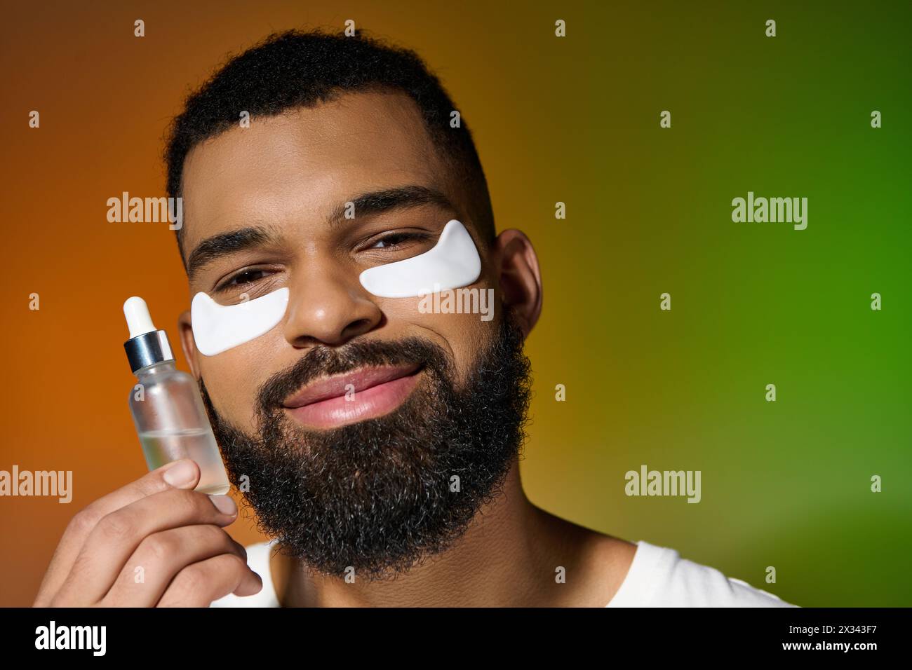 Handsome young man with beard and eye patches. Stock Photo