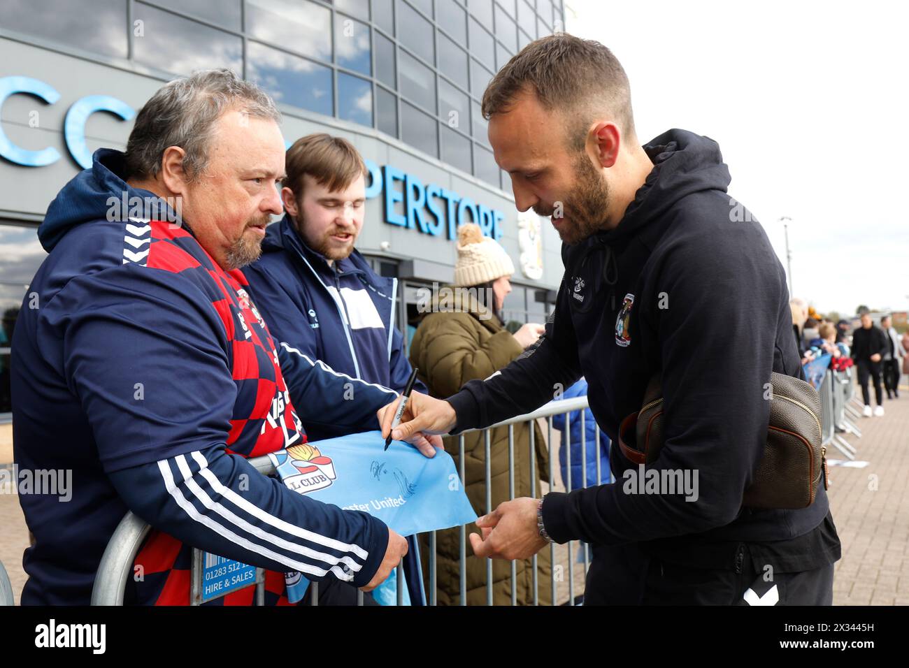 Coventry City's Liam Kelly signs autographs ahead of the Premier League match at Coventry Building Society Arena, Coventry. Picture date: Wednesday April 24, 2024. Stock Photo