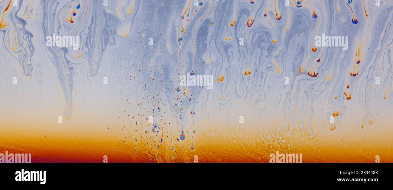 Colorful liquid mixture, blending paints in dynamic abstract fluid ...