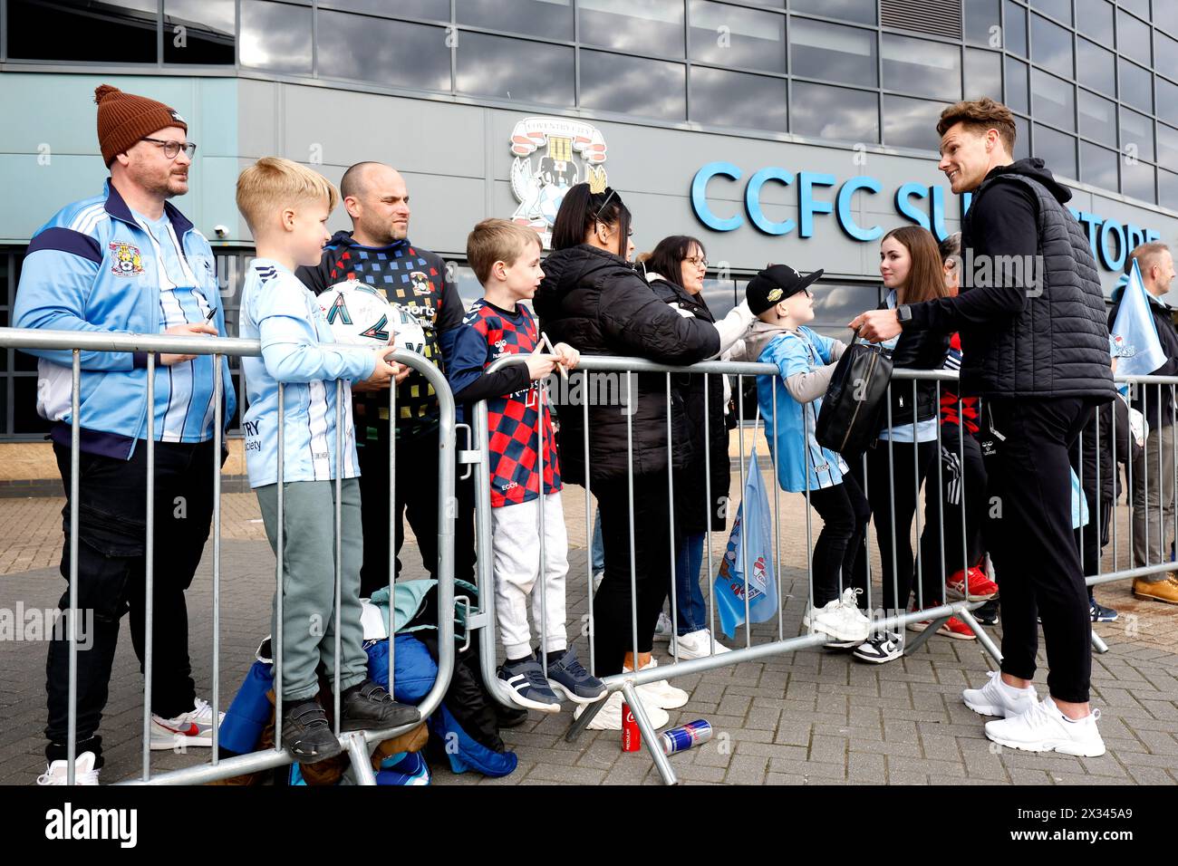 Coventry City goalkeeper Ben Wilson signs autographs ahead of the Sky Bet Championship match at Coventry Building Society Arena, Coventry. Picture date: Wednesday April 24, 2024. Stock Photo