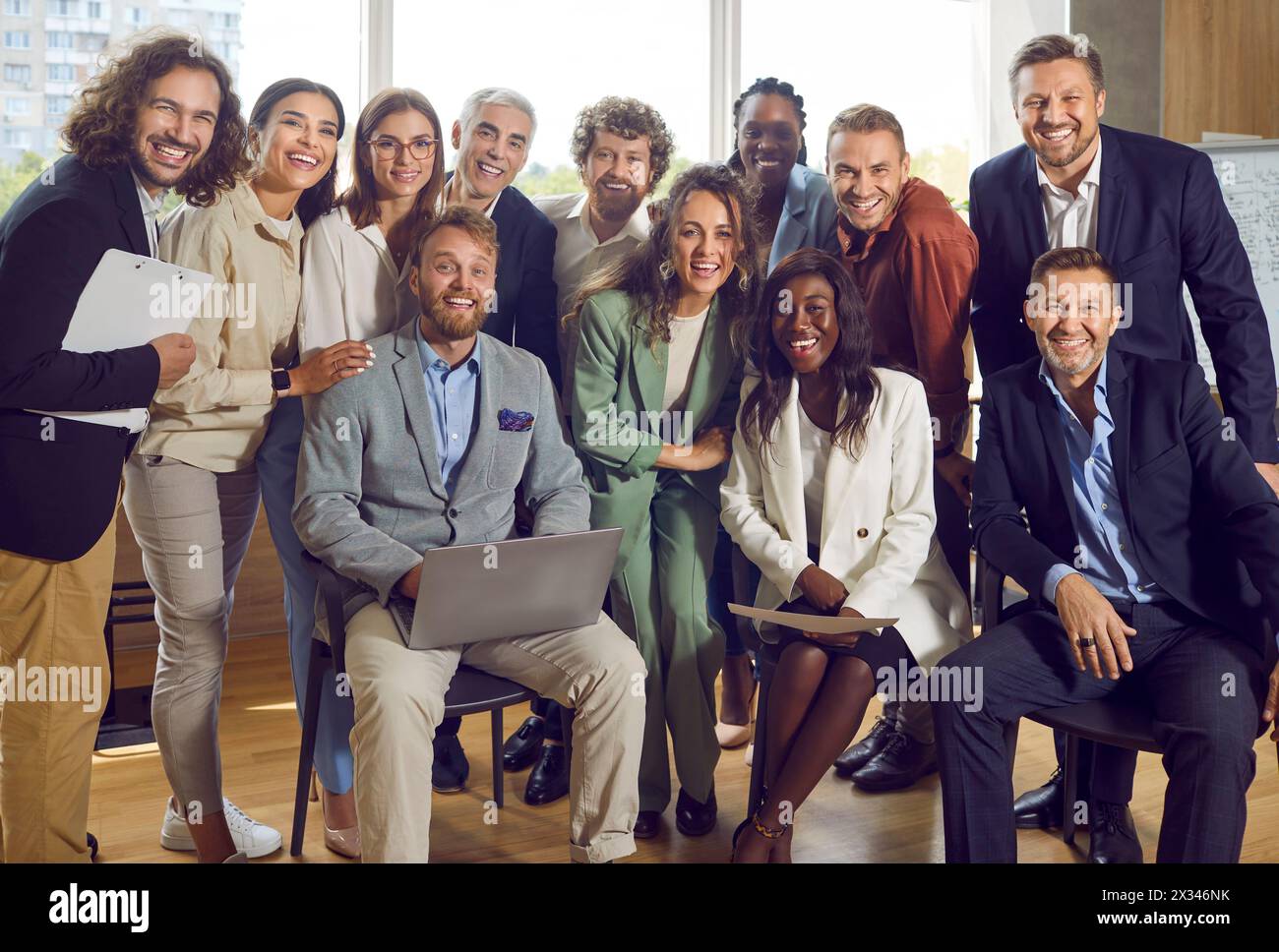 Portrait of large group of diverse business people working together on joint project. Stock Photo