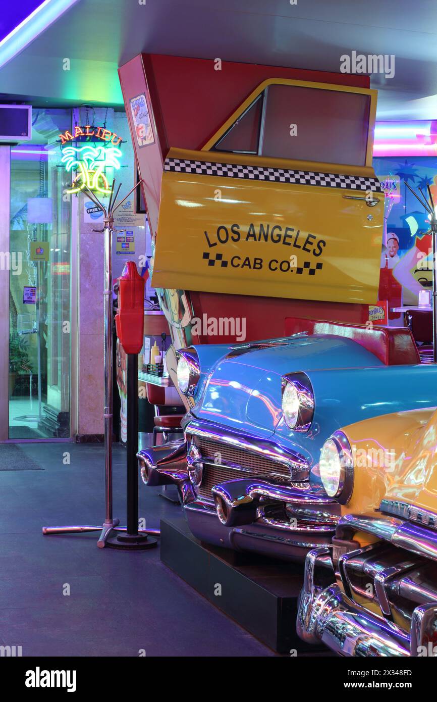 MOSCOW - JAN 21, 2015: Vintage cars in the interior American restaurant Beverly Hills Diner Stock Photo