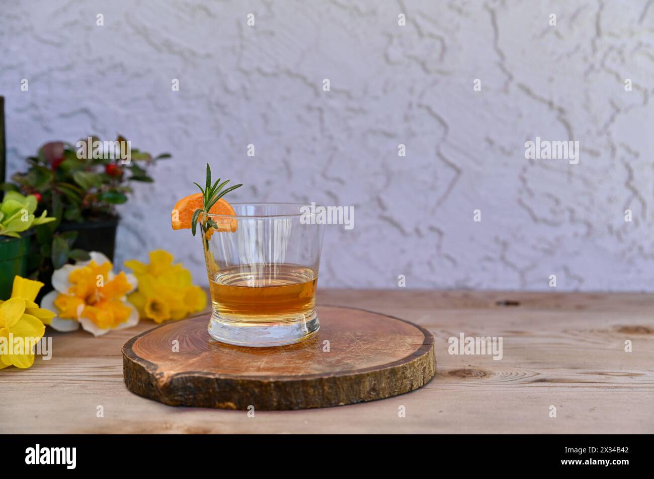 Outdoor patio bar with sipping bourbon, enjoying beverage and relaxing Stock Photo