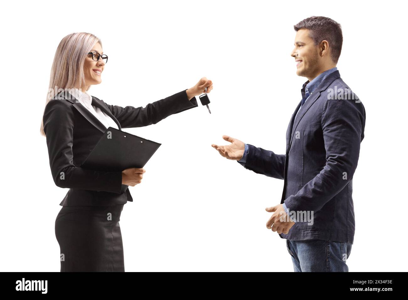 Professional woman giving car keys to a man isolated on white background Stock Photo