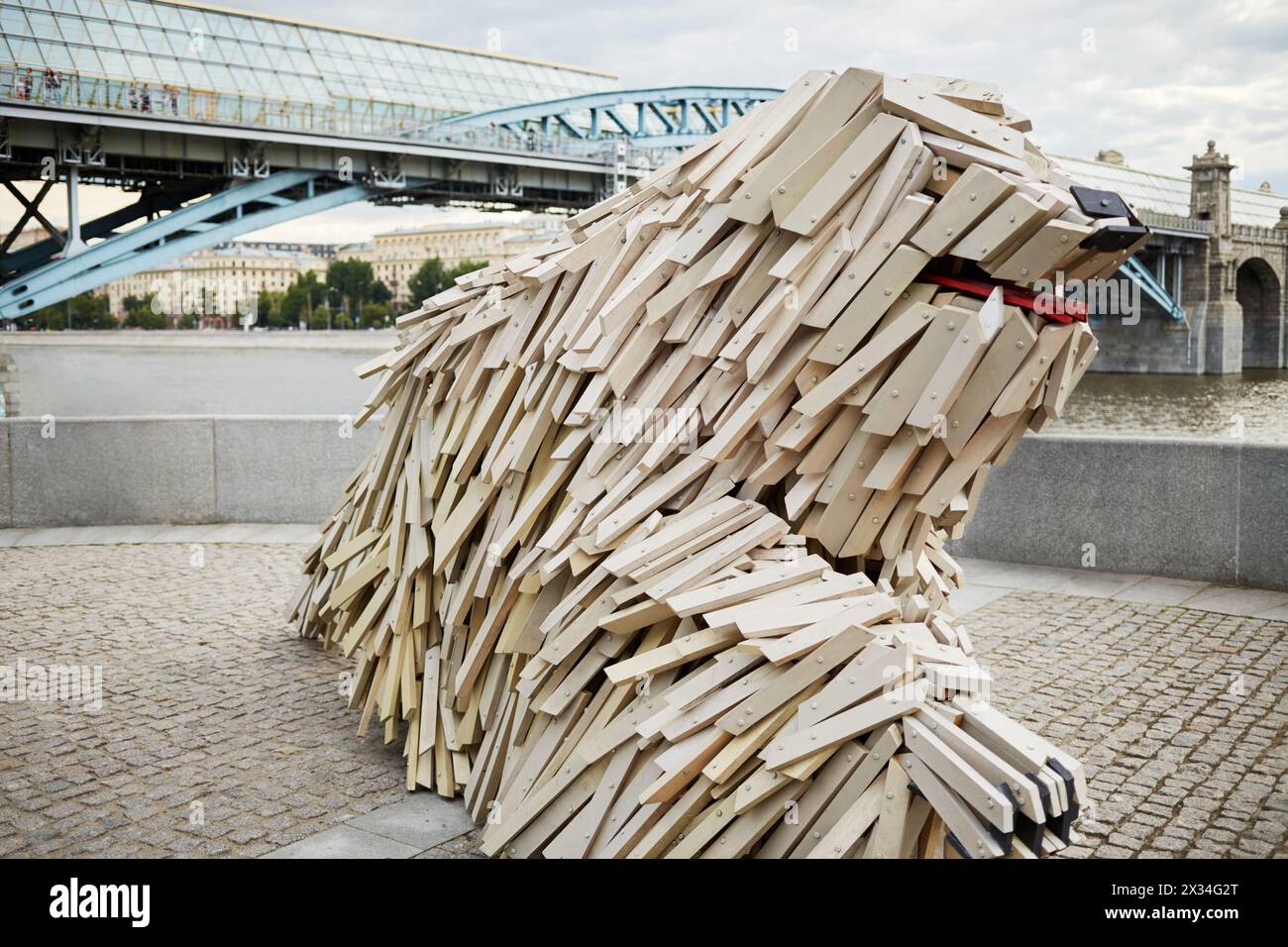MOSCOW, RUSSIA - JUN 29, 2015: Unique wooden sculpture of a dog breed Komondor by Gabor Miklos Szoke, internationally known sculptor, on Pushkinskaya Stock Photo