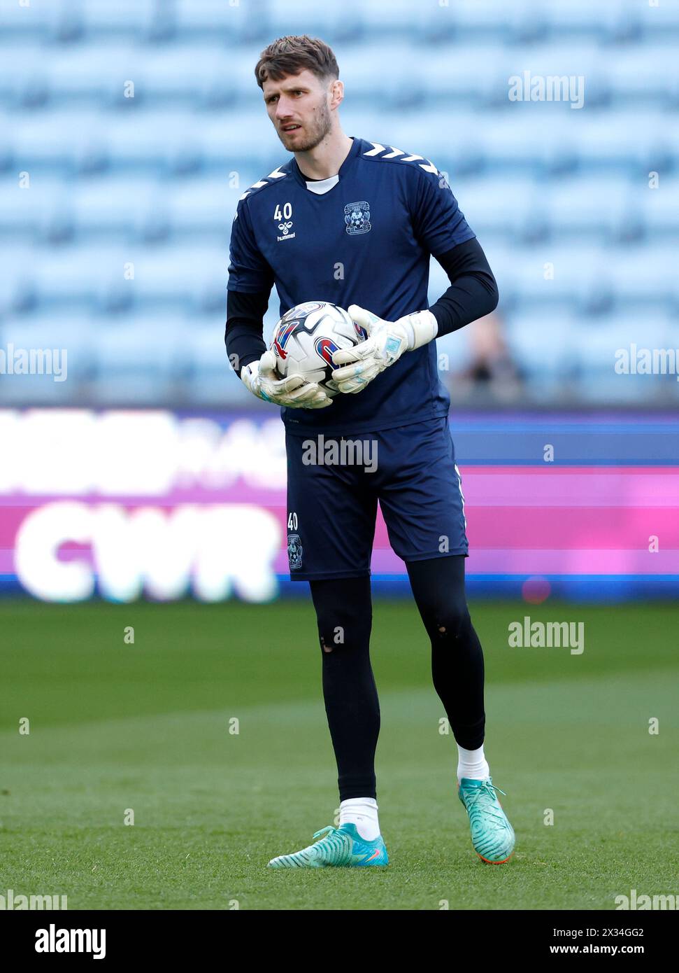Coventry City goalkeeper Bradley Collins warming up prior to kick-off before the Sky Bet Championship match at Coventry Building Society Arena, Coventry. Picture date: Wednesday April 24, 2024. Stock Photo