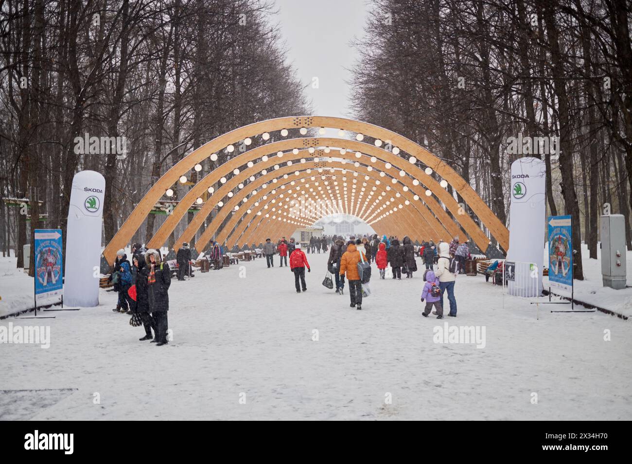 MOSCOW, RUSSIA - JAN 9, 2015: People walk at alley in Sokolniki park during New Year and Christmas holidays. Stock Photo