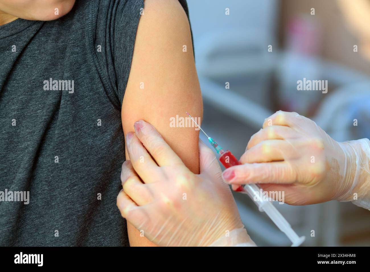 Shot of doctor hands making an injection with syringe of medicine Stock ...