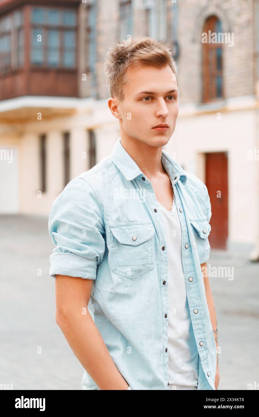 Young Man In Denim Clothes Outdoors Stock Photo