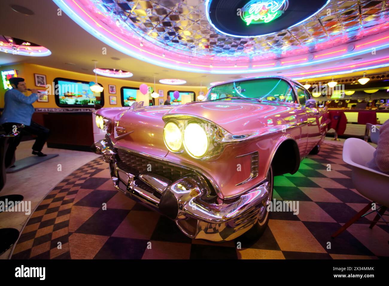 RUSSIAN, MOSCOW - JAN 18, 2015: Beverly Hills Diner restaurant with pink Cadillac in the middle. Stock Photo