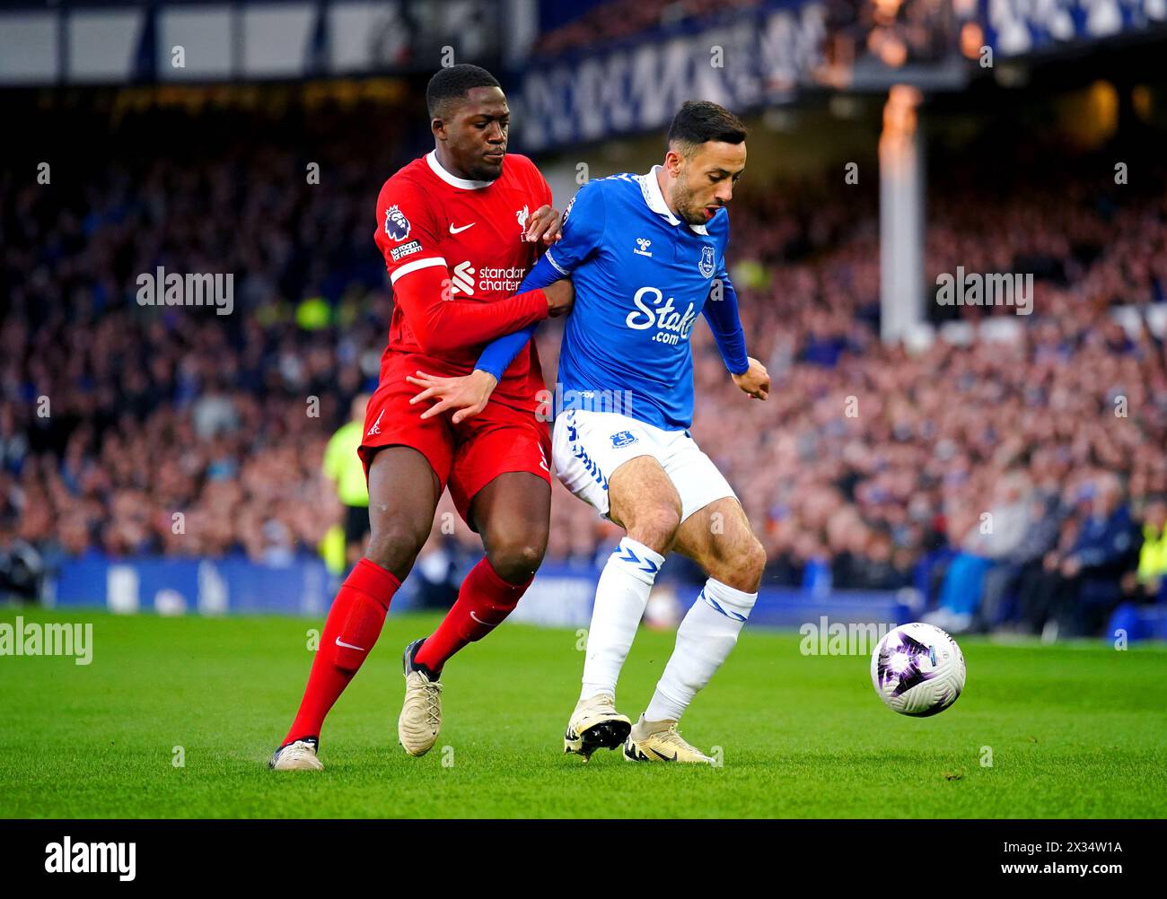 Liverpool's Ibrahima Konate (left) and Everton's Dwight McNeil battle for the ball during the Premier League match at Goodison Park, Liverpool. Picture date: Wednesday April 24, 2024. Stock Photo