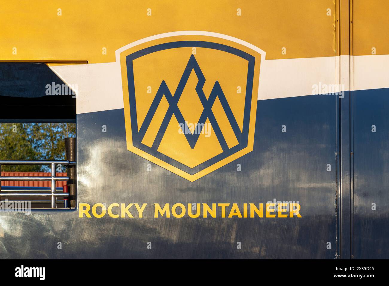 Gold leaf train wagon of the Rocky Mountaineer train with logo, British Columbia, Canada. Stock Photo