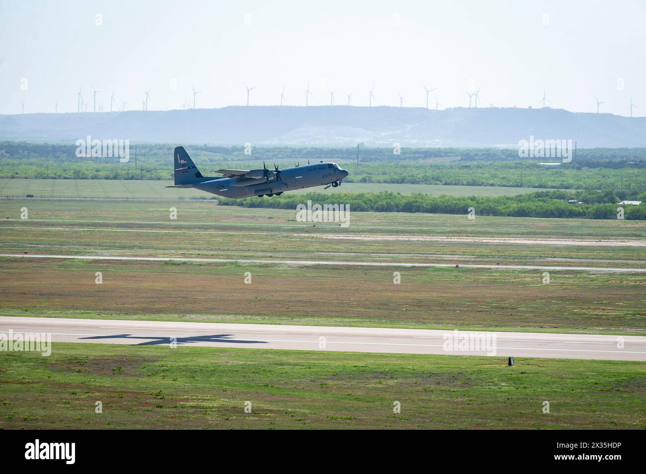 A U.S. Air Force C-130J Super Hercules assigned to the 40th Airlift Squadron takes off  from Dyess Air Force Base, Texas, in support of a Maximum Endurance Operation to Andersen Air Force Base, Guam, April 18, 2024. During the operation, one C-130J Super Hercules equipped with external fuel tanks embarked on a remarkable 26-hour single-aircraft mission, validating the aircraft's extended range capabilities but also showcasing the multi-day mission generation capabilities of the squadron. Stock Photo