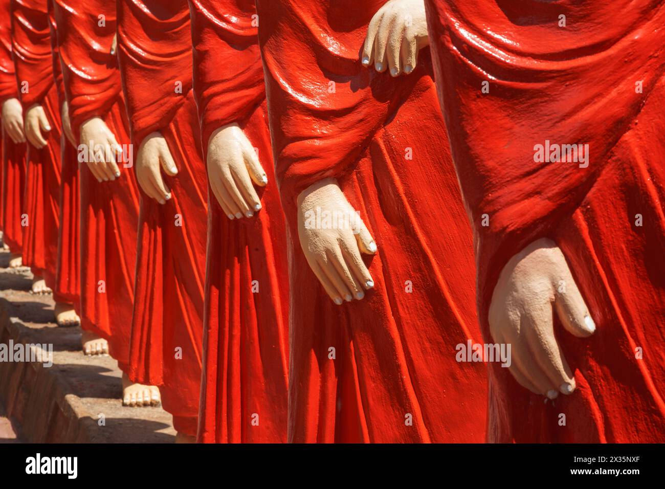 Standing buddhist monk statues hi-res stock photography and images - Alamy