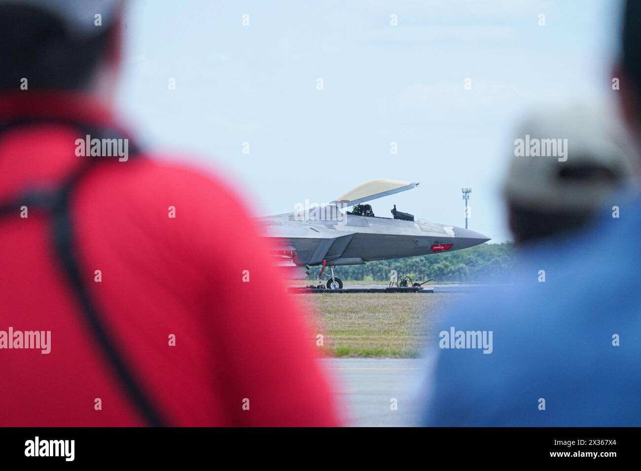 Sanford, Florida, USA, April 21, 2025, Spectators looking at the F22