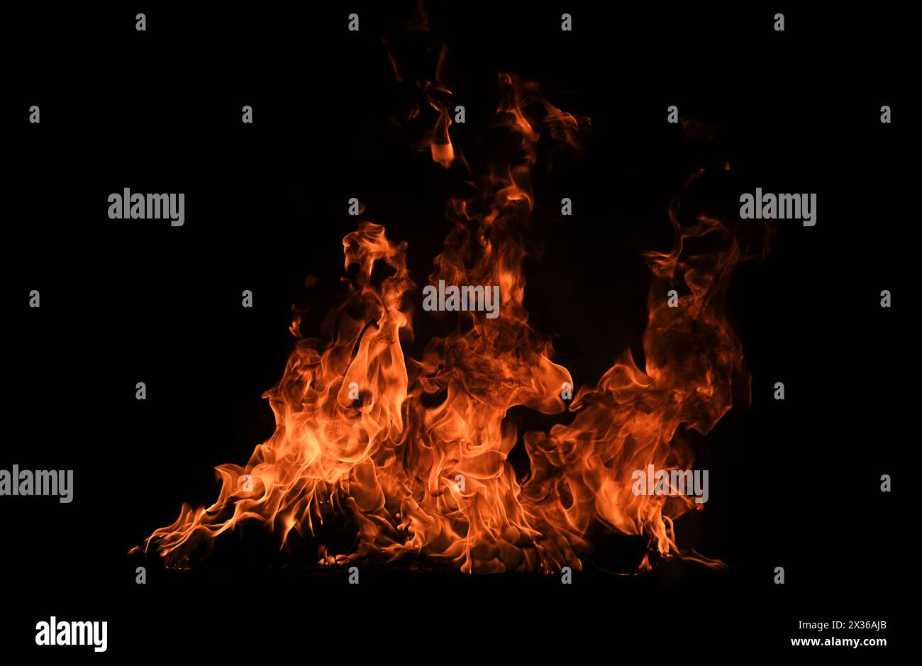 Blaze burning fire flame on art texture background. Stock Photo