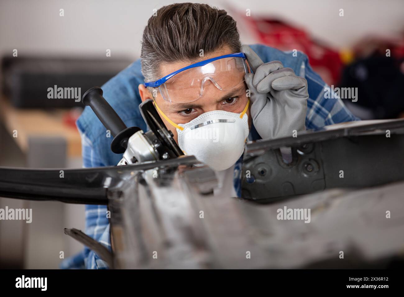 coachbuilder at work in garage Stock Photo