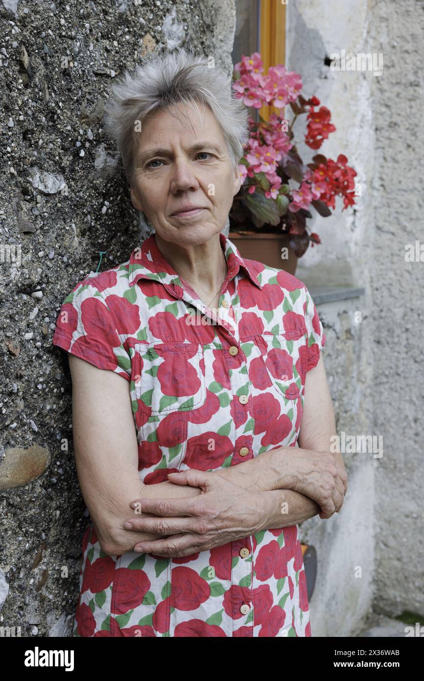 Fagagna (Udine), Italy, July 12, 2023. The German writer, poet and translator Esther Kinsky portrayed in the garden of her house in Fagagna, a village in Friuli, a region to which she is particularly attached and which inspired her to write 'Rombo' (Iperborea, 2023), a novel that recalls, through seven inhabitants of a valley in the extreme north-east of the region, the days of the violent earthquake that hit Friuli on May 6, 1976. 'Rombo' is the winner of the Kleist Prize, candidate for the Deutscher Buchpreis and the European Strega Prize 2023.Esther Kinsky is one of the highest and most ori Stock Photo