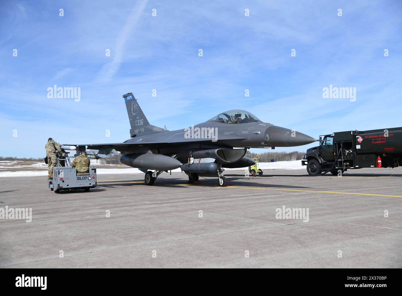 Aircraft Armament Specialists assigned to the 148th Fighter Wing, Minnesota Air National Guard, are evaluated while loading CATM-120s during an Integr Stock Photo