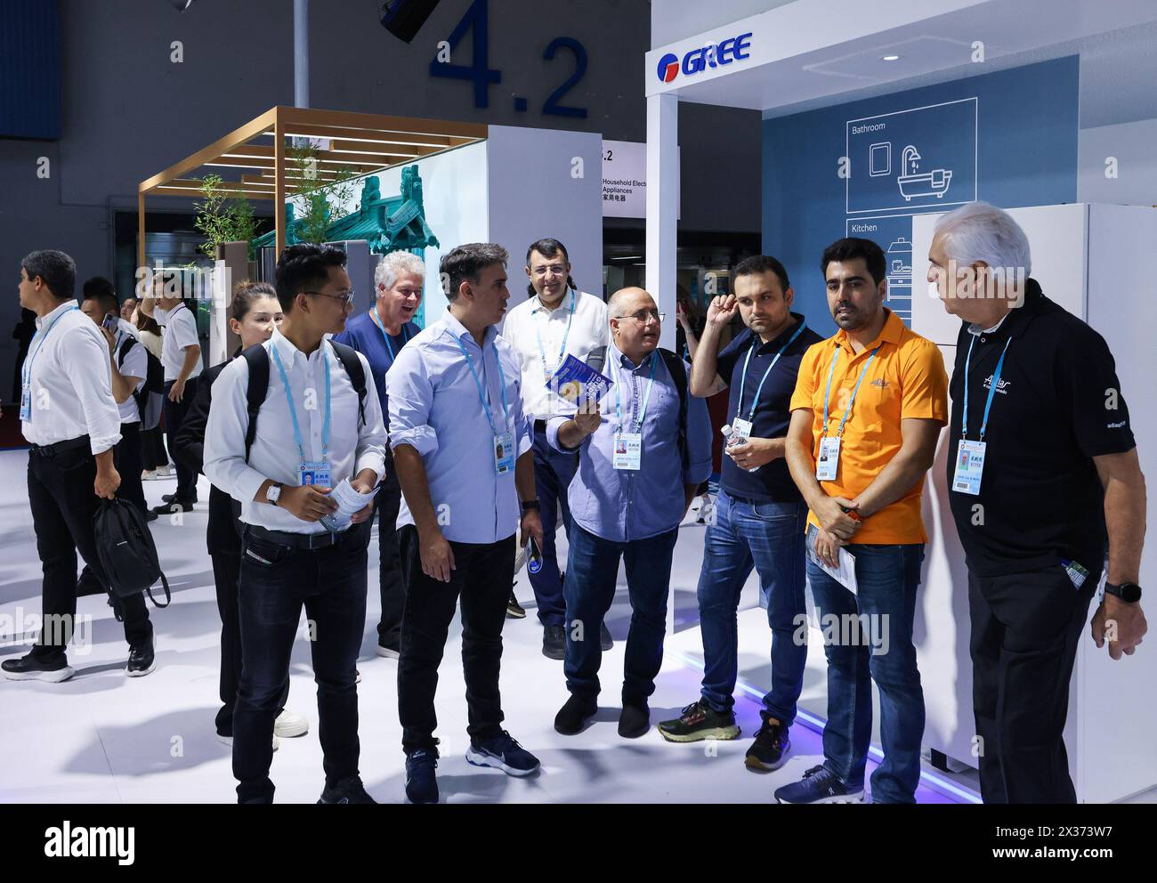 Guangzhou, China's Guangdong Province. 15th Apr, 2024. Overseas purchasers learn about smart home appliances at the booth of Gree during the 135th session of the China Import and Export Fair in Guangzhou, south China's Guangdong Province, April 15, 2024. As of 5:00 p.m. on Tuesday, a total of 172,901 purchasers from 214 countries and regions have physically attended the 135th session of the China Import and Export Fair, commonly known as the Canton Fair, an increase of 21.6 percent over the same period last year. Credit: Liu Dawei/Xinhua/Alamy Live News Stock Photo