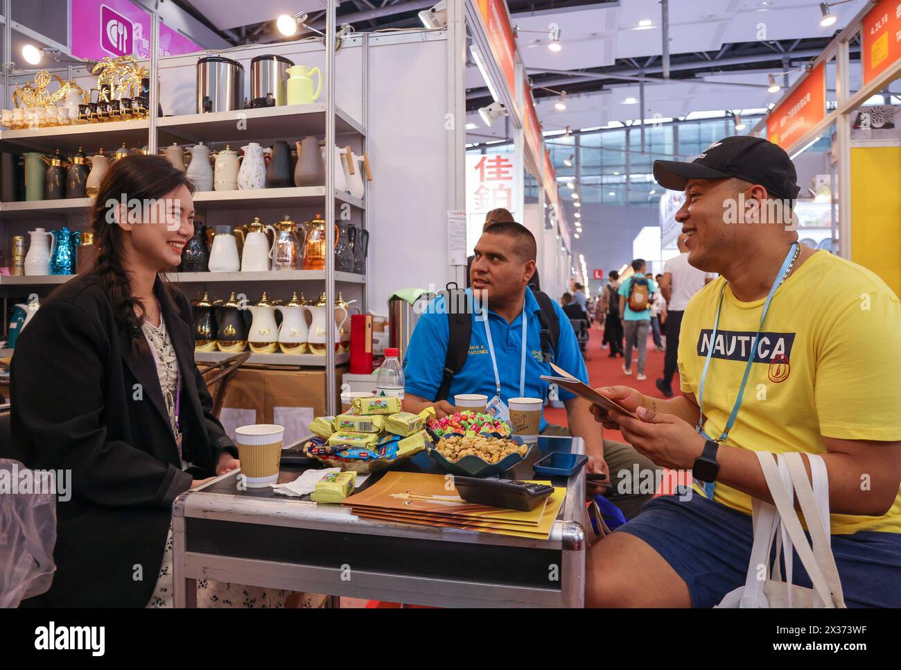 Guangzhou, China's Guangdong Province. 24th Apr, 2024. Purchasers from Venezuela (R and C) talk to an exhibitor during the 135th session of the China Import and Export Fair in Guangzhou, south China's Guangdong Province, April 24, 2024. As of 5:00 p.m. on Tuesday, a total of 172,901 purchasers from 214 countries and regions have physically attended the 135th session of the China Import and Export Fair, commonly known as the Canton Fair, an increase of 21.6 percent over the same period last year. Credit: Liu Dawei/Xinhua/Alamy Live News Stock Photo