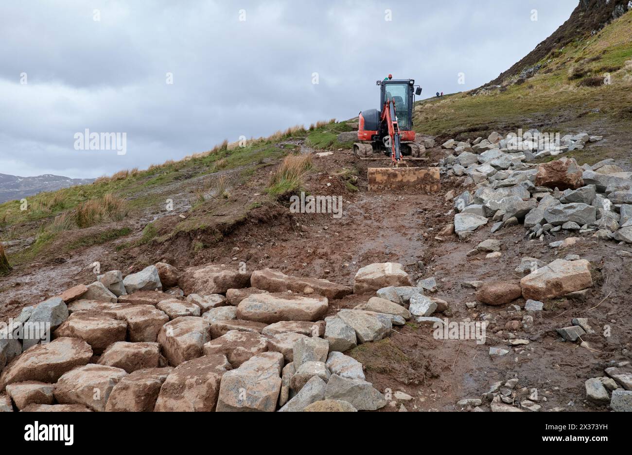 Digging Rough Stone Excavator used for digging and arranging stones to form new, hard ...