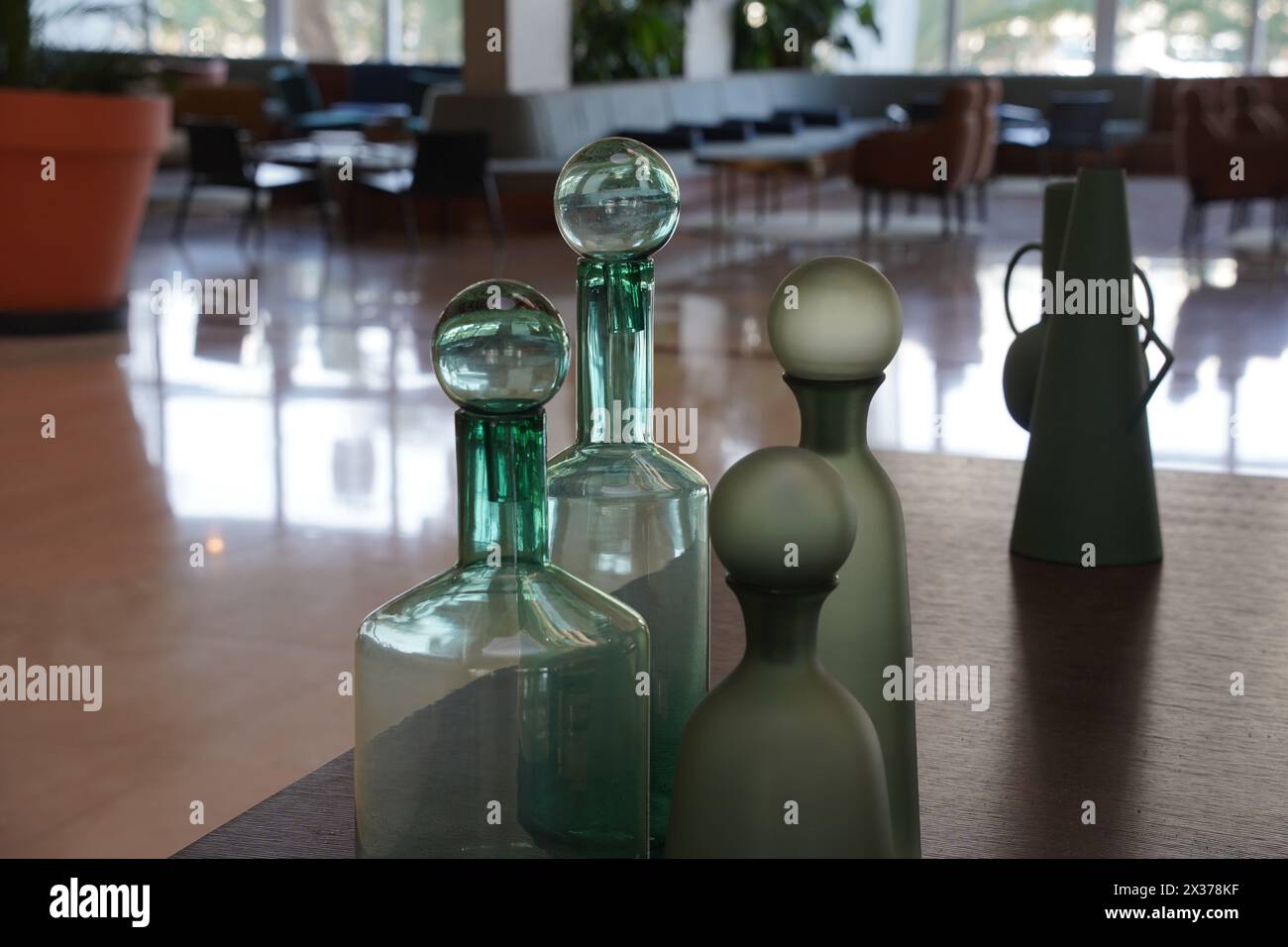 The interior of a hotel lobby. Decorative Glass vases Stock Photo