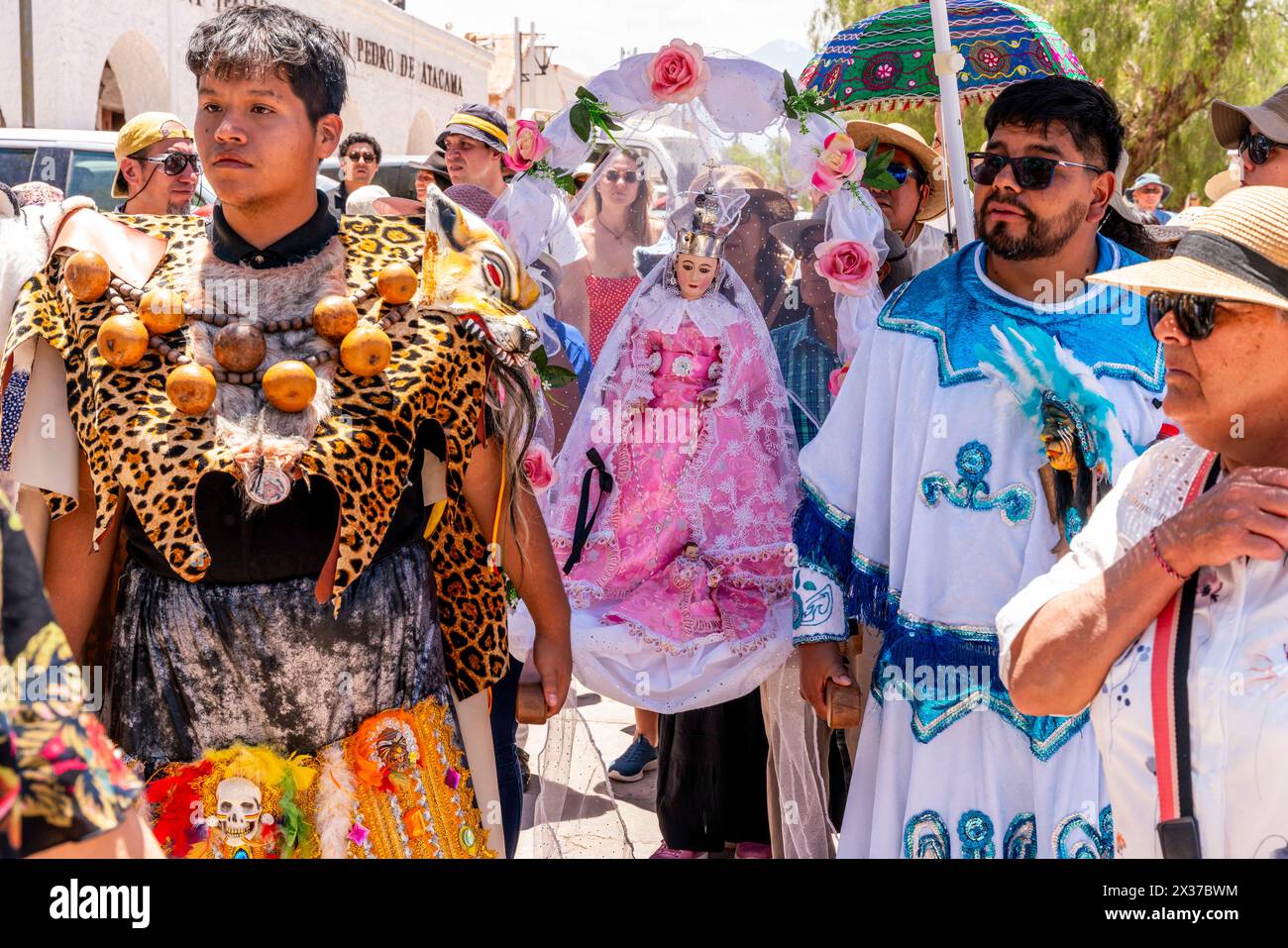 Local People Carry A Statue of The Virgin Mary Around Town During La Fiesta de la Virgen de la Candelaria, San Pedro de Atacama, Chile Stock Photo