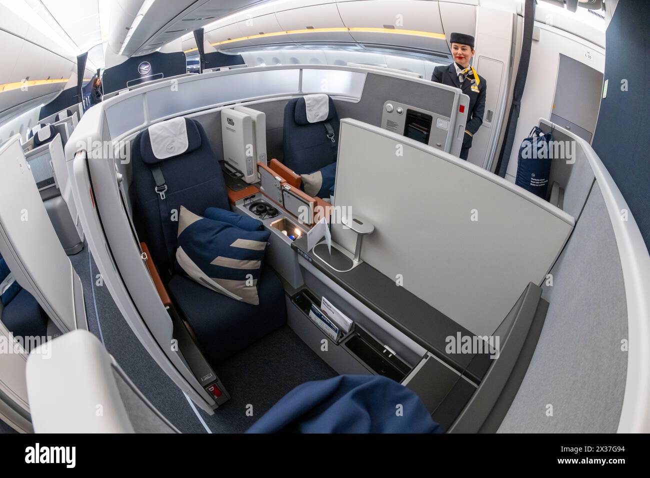Munich, Germany. 25th Apr, 2024. A new Business Class 'Allegris' cabin on an Airbus A350-900. The artificial term 'Allegris' refers to a new cabin concept that will mean new seating for all four travel classes of the long-haul aircraft. From May 2024, the new Lufthansa cabin will take off for the first time in an Airbus A350-900 and aims to set new standards in all classes with state-of-the-art seats and other innovations. Credit: Peter Kneffel/dpa/Alamy Live News Stock Photo