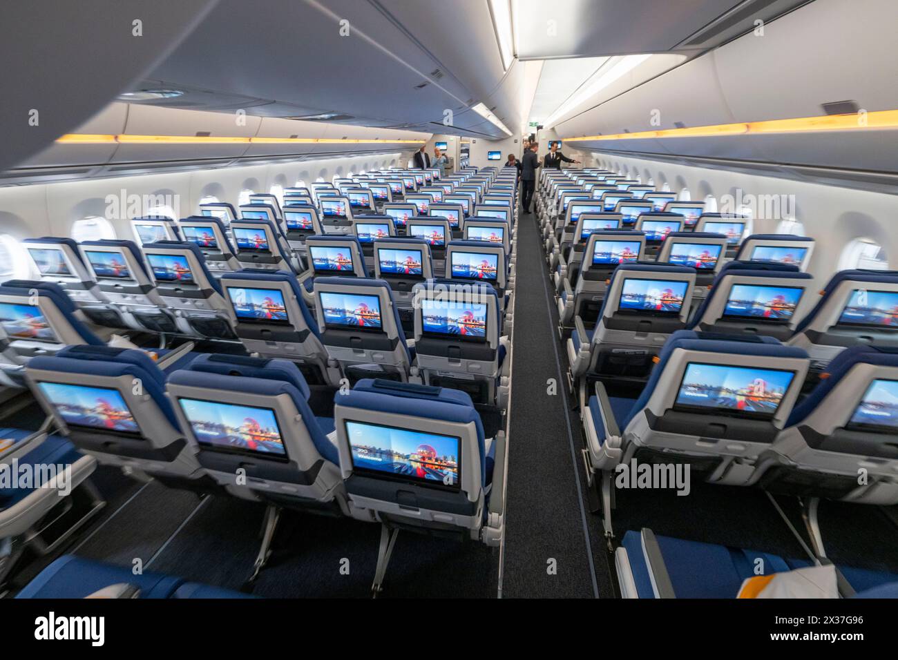 Munich, Germany. 25th Apr, 2024. Economy Class seats with their screens during the presentation of Lufthansa "Allegris" in an Airbus A350-900. The artificial term "Allegris" refers to a new cabin concept that will mean new seating for all four travel classes of the long-haul aircraft. From May 2024, the new Lufthansa cabin will take off for the first time in an Airbus A350-900 and aims to set new standards in all classes with state-of-the-art seats and other innovations. Credit: Peter Kneffel/dpa/Alamy Live News Stock Photo