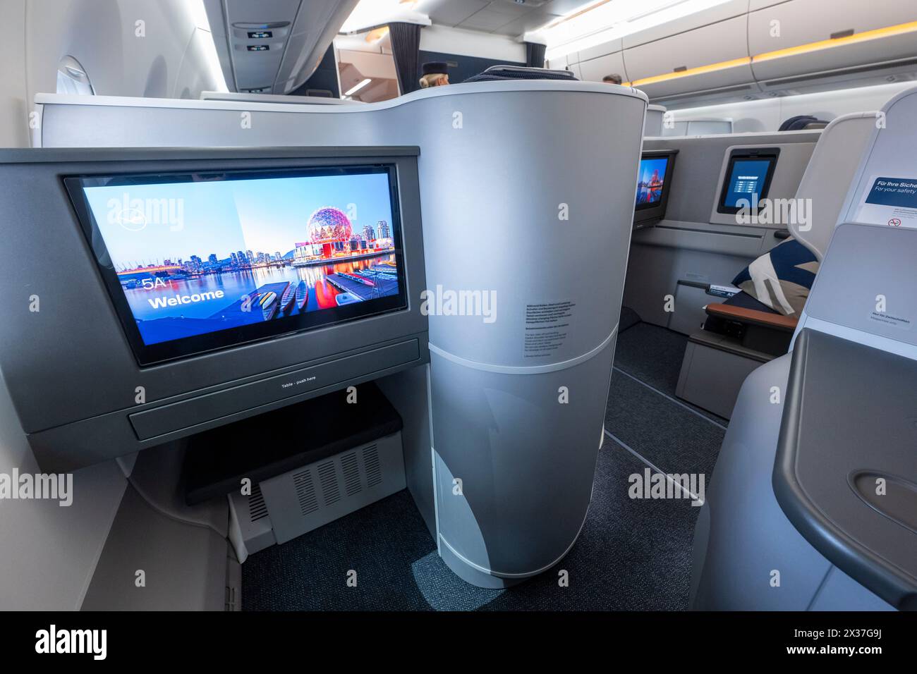 Munich, Germany. 25th Apr, 2024. View from a new Business Class "Allegris" cabin on an Airbus A350-900. The artificial term "Allegris" refers to a new cabin concept that will mean new seating for all four travel classes of the long-haul aircraft. From May 2024, the new Lufthansa cabin will take off for the first time in an Airbus A350-900 and aims to set new standards in all classes with state-of-the-art seats and other innovations. Credit: Peter Kneffel/dpa/Alamy Live News Stock Photo