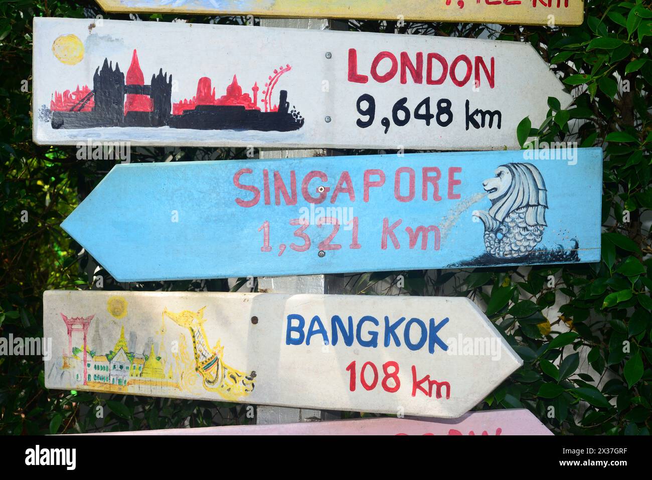 signpost sign to london, singapore, bangkok in pattaya thailand Stock Photo