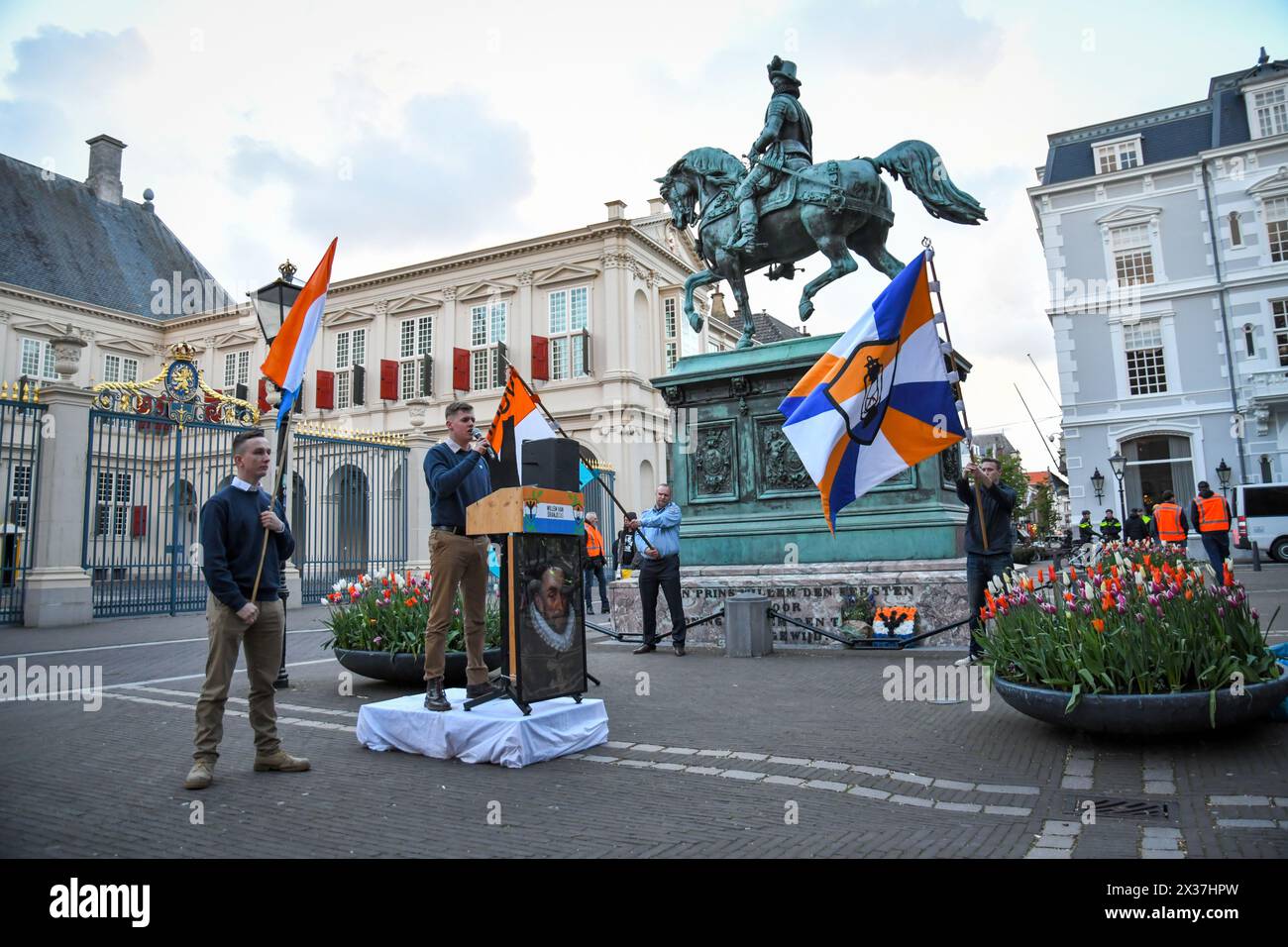 04-24-2024.The Hague,The Netherlands.Dutch Belgian conservative right wing groups 'Voorpost','Geuzenbond' and 'Schild en vrienden' held a ceremony at the statue of William of Orange.They laid flowers and speaches were given.There was a small counterprotest, but they were kept apart by police. Stock Photo