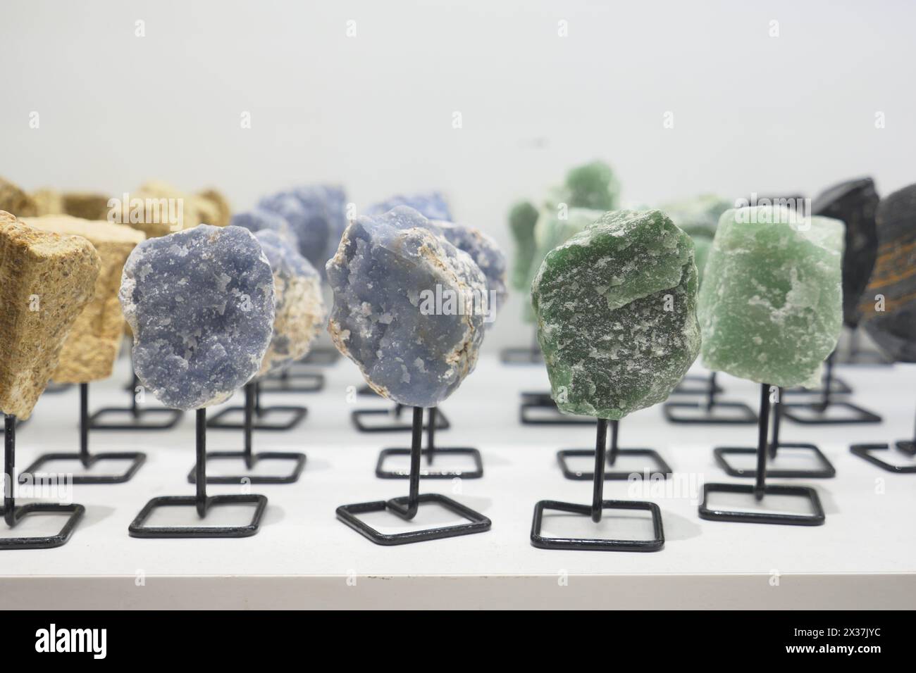 Various rocks are showcased on a table for art display Stock Photo - Alamy