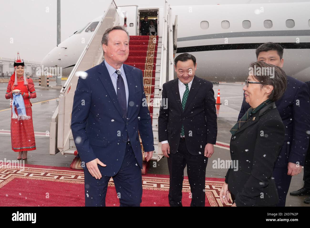 British Foreign Secretary Lord David Cameron arrives in the snow at ...