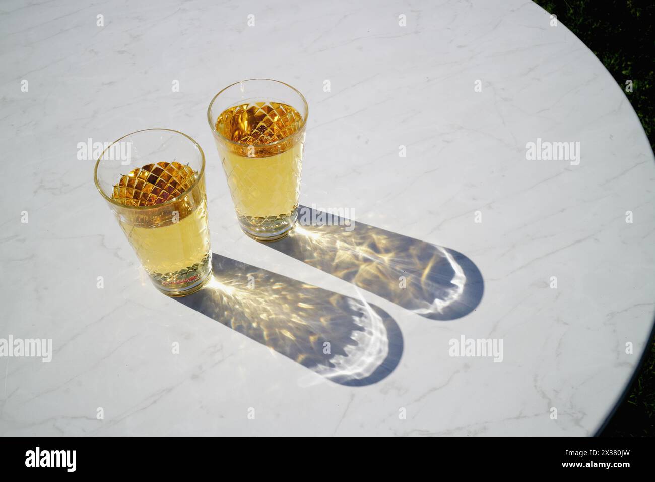 Two Glasses Of Cider In The Sun Stock Photo