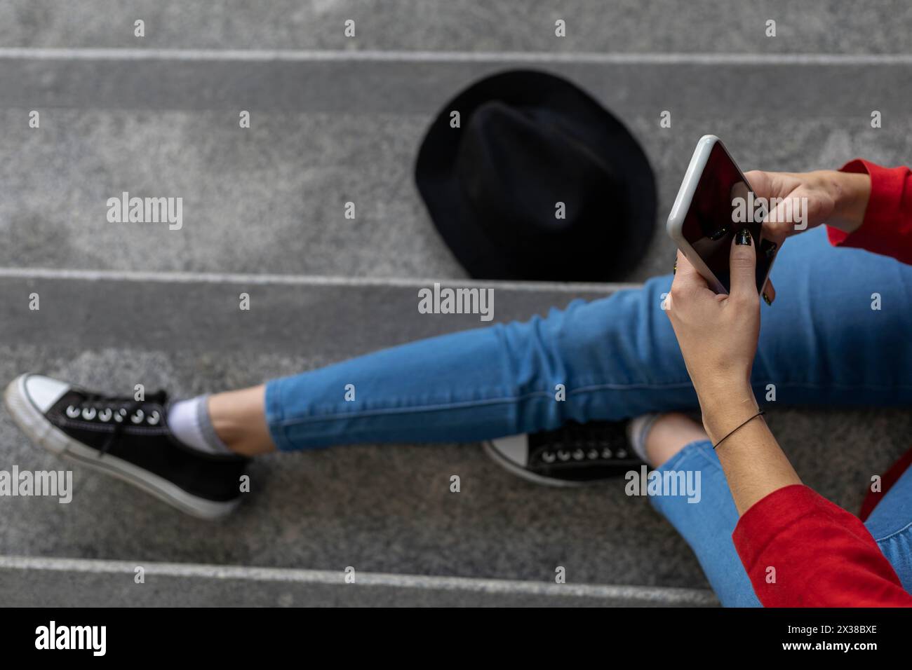 Young (23) unrecognizable Latin American woman (23) sitting on the ...