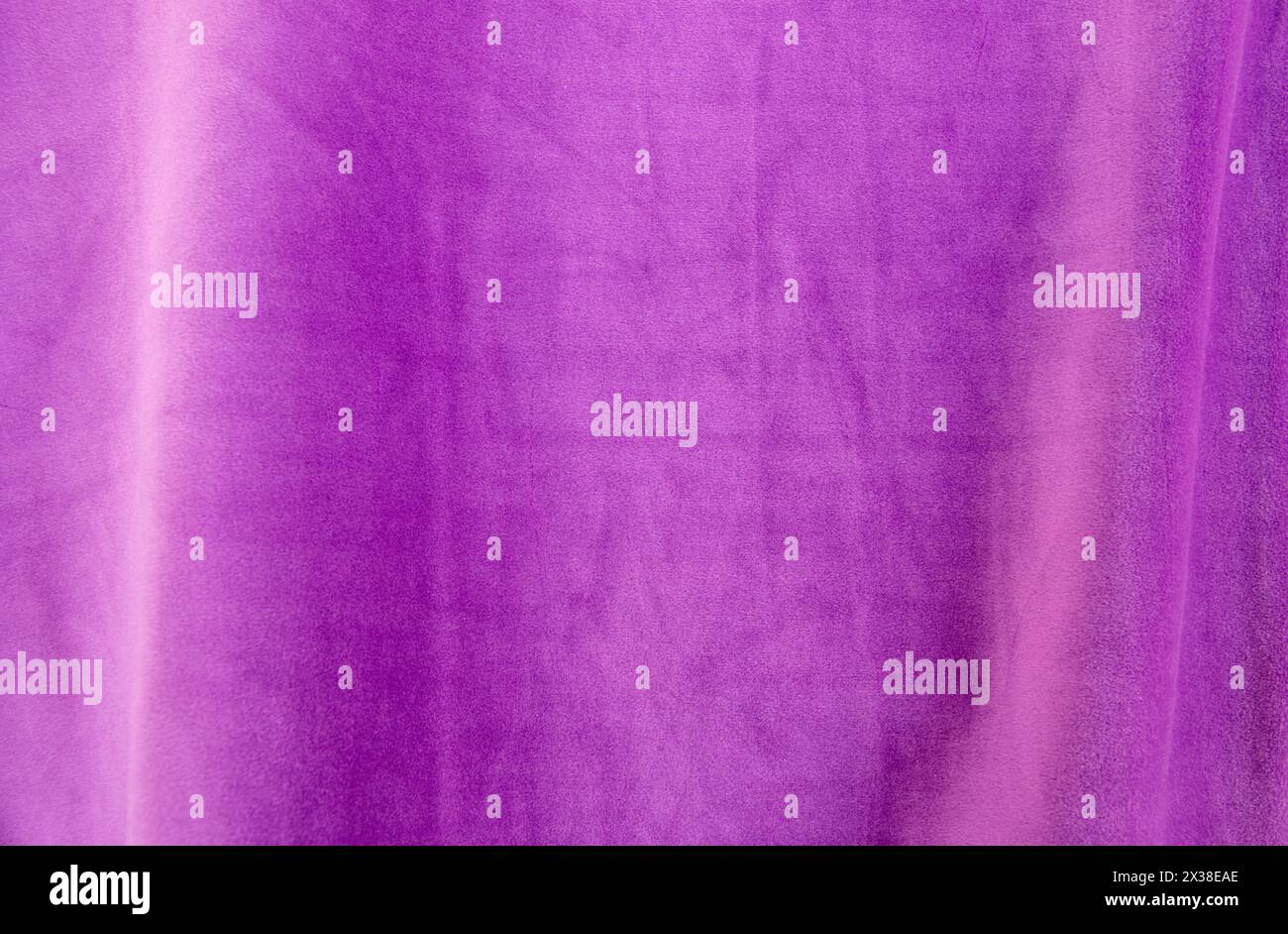 Lilac knitted texture fabric. Purple textile cloth background. Soft material for fashion clothes. Stock Photo