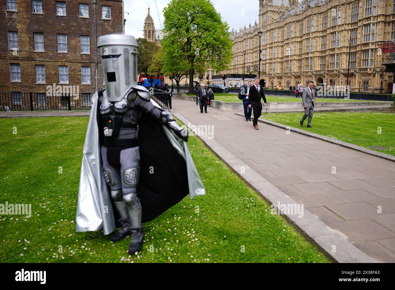 Tommy Robinson, real name Stephen Yaxley Lennon (right) walks past the