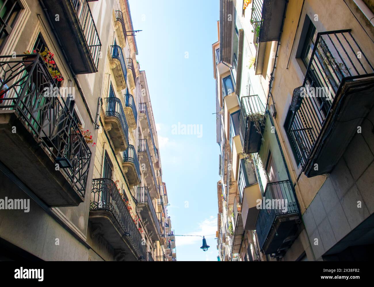 Empty street with beautiful historic houses, windows, stone road in the center of old town. Spain. Stock Photo